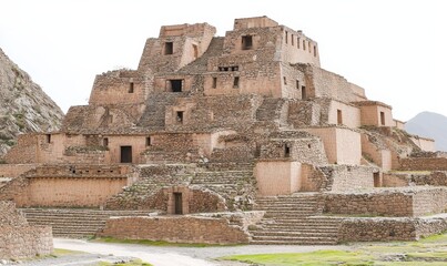 Fototapeta premium Ancient stone pyramid ruins in mountain valley, historical architecture, potential travel destination