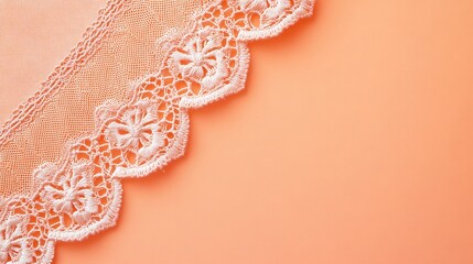 Delicate white lace on a peach background