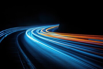 Dynamic light trails of vehicles on a curved road at night motion photography urban setting