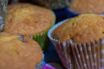 Freshly baked muffins in colorful paper liners
