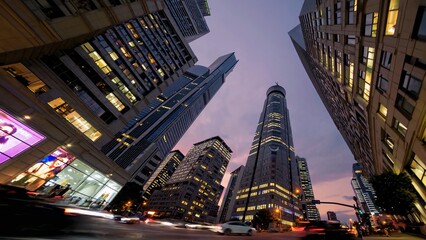 Twilight cityscape revealing urban vibrancy, high rise towers glimmering, streets flowing with vehicle lights capturing metropolitan dynamism and architectural magnificence