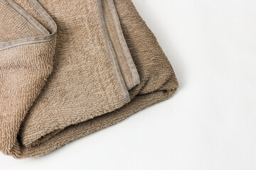Close up of dirty and worn towel isolated on white background.
