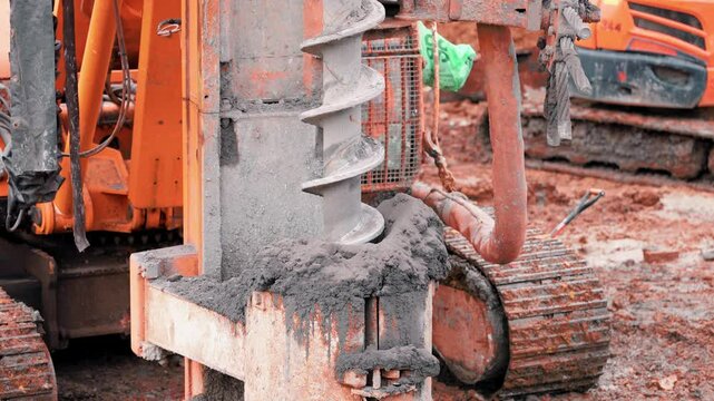 Close-up of Piling rig drilling ground for foundation work at construction site