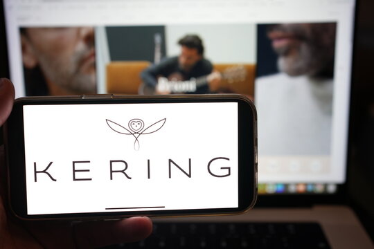 Roosendaal, The Netherlands - February 10, 2025: A mobile phone displaying the logo of Kering, with the website in the background.