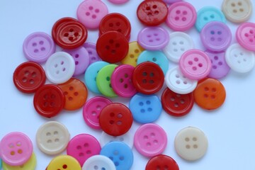 buttons on a white background, colored buttons, variety of buttons 