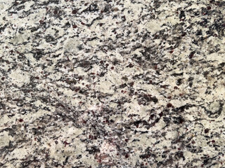 Natural granite surface showcasing intricate patterns and textures in neutral tones