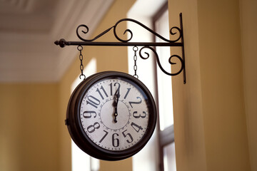 Large round wall clock with hands, retro design, time