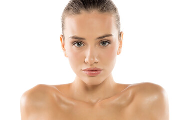Intense beauty portrait of a woman with glowing skin, piercing gaze, and natural makeup, revealing...