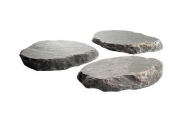 The image shows three flat, irregularly-shaped grey stones or slate platforms against a transparent background.
