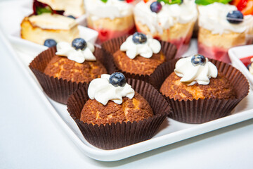 Catering buffet or service with different snacks, appetizers and canapes on a table. Variety of Freshly Prepared Catering Food for an Event.