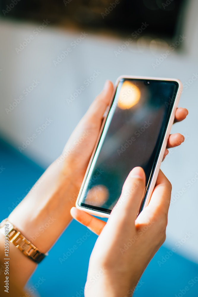Poster selective focus on female hands holding cellphone technology for browsing internet website during le