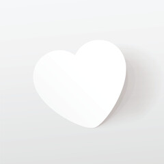 a white paper heart on white back