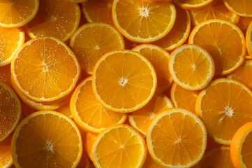 Bright orange slices layered in beautiful harmony showcase nature's vibrant beauty in a sunlit kitchen
