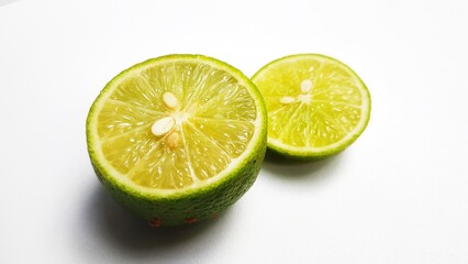 Close-up of lime slices on white background