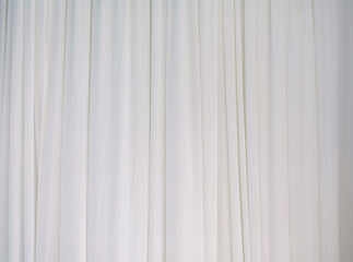 The white curtains are wavy and flowing.