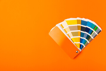 Color palette on a bright colored background. Color palette guide. paper catalog of rainbow color. creative.Palette, samples of trending colors. Color swatches. Decor and interior designer. Top view. 