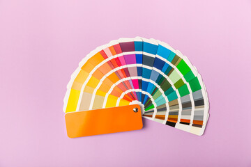 Color palette on a bright colored background. Color palette guide. paper catalog of rainbow color....