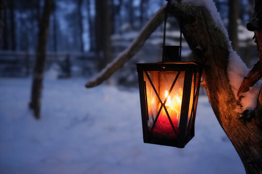 Cozy lantern with a glowing candle hanging on a tree during a serene polar night in Lapland, surrounded by a snowy forest. Perfect for capturing the peaceful charm and magic of a winter night.