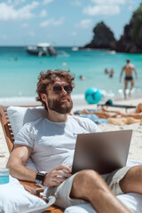 Funny entrepreneur checks his laptop while sit along soft beach sands under clear blue skies