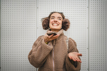 woman record voice message or use speech recognition on cellphone