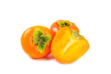 Persimmon isolated on white background. Persimmon fruit. Slice of ripe, juicy, sweet persimmon fruit. Vegan. Fruit garden. Close-up.