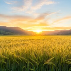 Obraz premium Golden Wheat Field at Sunset with Majestic Mountains in Background