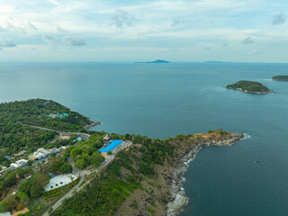 Obraz premium aerial view at Laem Promthep Cape viewpoint. Promthep cape is the most popular viewpoint in Phuket..Man island, Yanui beach small beach and wind turbine are also a sunset viewing spot..