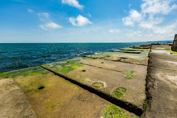 View of abandoned sea resort concrete buildings and structures in ruins near St. Constantine and Helena, city of Varna, Bulgaria, the shores of Black Sea, EU