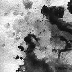 A watercolor background with black splashes