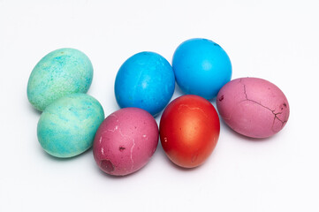 Homemade colored Easter eggs  on the white background  ready to be split to  friends and family for Easter