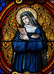 Stained glass (19th century) of St. Margaret Mary Alacoque or Sainte Marguerite Marie Alacoque. .