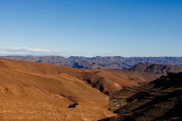 Mountain areas, with sand and rocks on the surface, travel destination in Africa, Morocco.