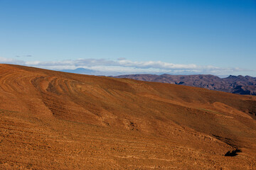 Mountain areas, with sand and rocks on the surface, travel destination in Africa, Morocco.