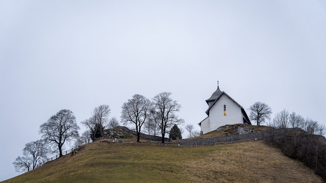 Countryside church on a hill under the sky in festival of Swiss