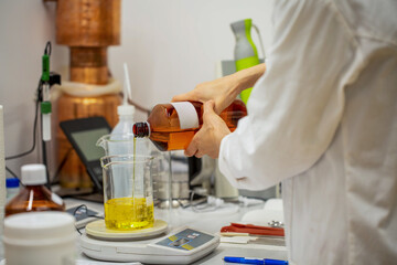 Pouring Natural Oil in Laboratory for Cosmetic Production