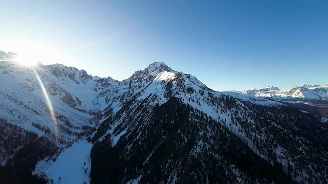 The majestic Swiss Alps at sunset, with snow-covered mountains and frosted forests, highlighting the serene beauty of Champex Lac during a peaceful winter evening.