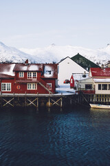 Fototapeta premium Small local houses on coast in snow