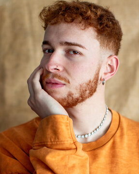 Portrait of a Stylish Man with Red Curly Hair