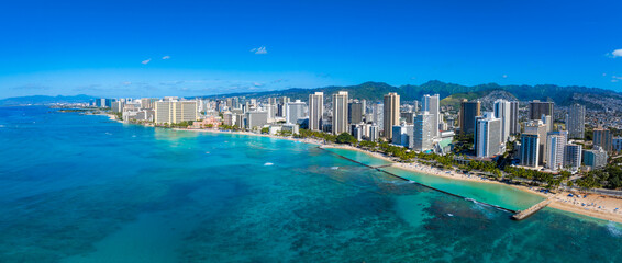Aerial view of Waikiki Beach in Honolulu, Oahu, Hawaii, featuring turquoise waters, high rise...