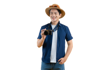 Portrait of young asian man using travel camera and posing on yellow background