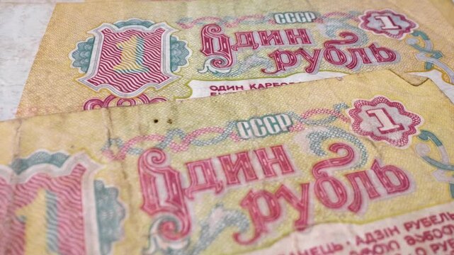 Extreme close-up of 1 old Soviet ruble banknotes, currency from 1961&ndash;1993, with a sliding movement.
