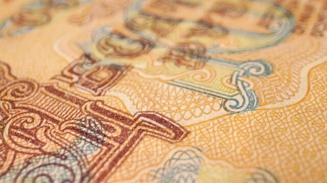 Extreme close-up of a 10 old Soviet ruble banknote, currency from 1961&ndash;1993, with a sliding movement