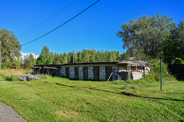 Fototapeta premium Collapsed building in the abandoned ghost town of Viivikonna as a lost-place sight near Narva in Estonia, summer under a blue sky