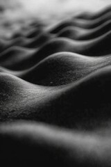 Abstract close-up of black and white sand dunes textured waves
