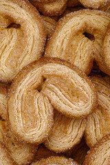 A variety of puff pastry cookies with sugar and cinnamon