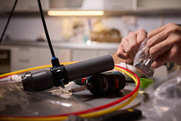 Hands Working with Various Tools and Equipment in a Creative DIY Setting and Space