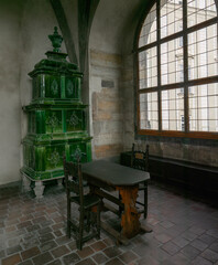 Old, green coal-fired tiled stove.