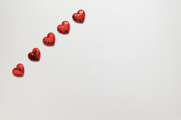 hearts made of red fabric on a light background