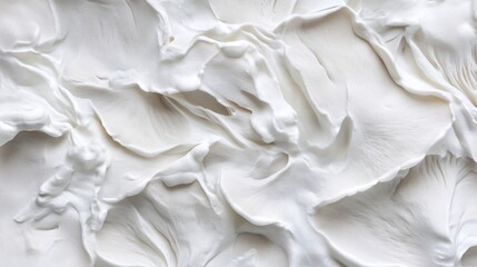 Fototapeta premium A delicate, textured surface of creamy white petals resembling soft whipped cream.