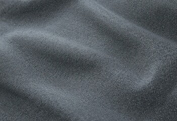 A close-up of a smooth, gray fabric with a tightly woven pattern. The material has a glossy finish and is likely used for outdoor gear such as jackets or backpacks due to its durability